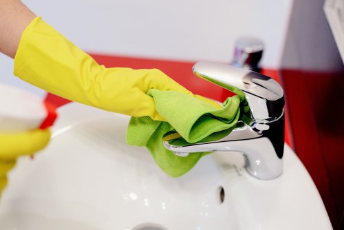 Carpet cleaner preparing equipment safely before starting work