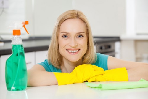 Cleaning technician preparing carpet cleaning equipment for a booked service