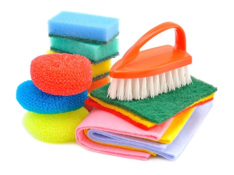 Cleaner washing a shopfront window in Dulwich